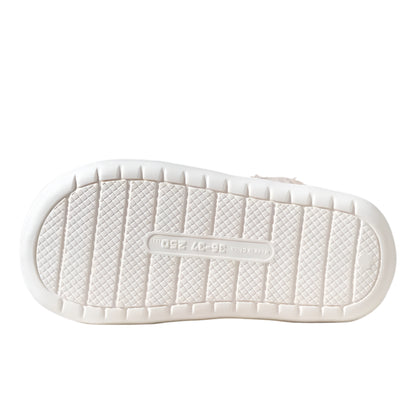 White shoe sole with anti-slip pattern on a neutral background