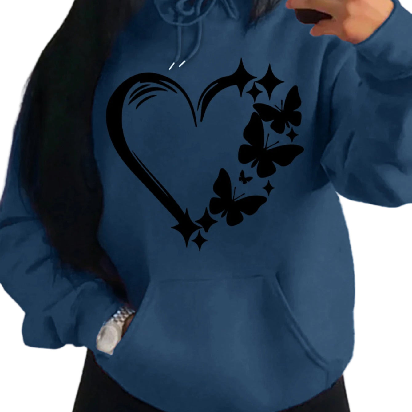 Person wearing a blue hoodie with a black heart and butterfly design.