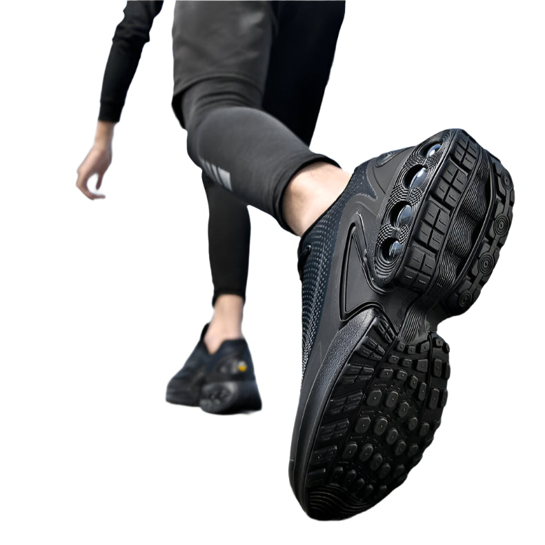 Person wearing black athletic shoes on a bridge