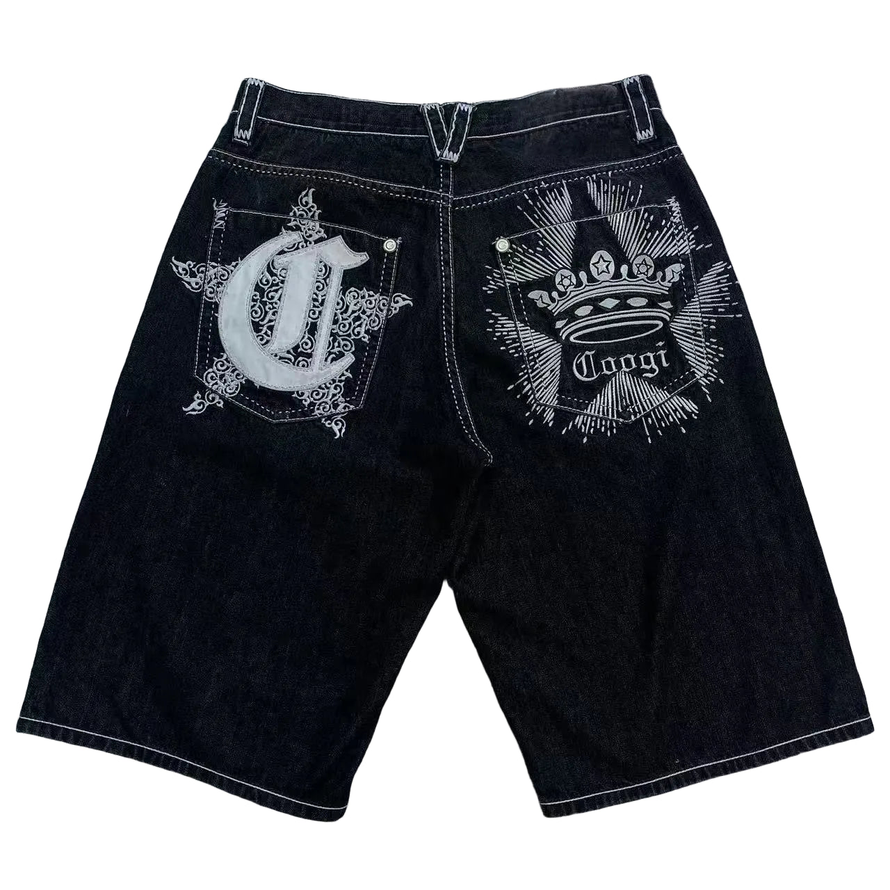 Black shorts with white embroidery on a gray surface