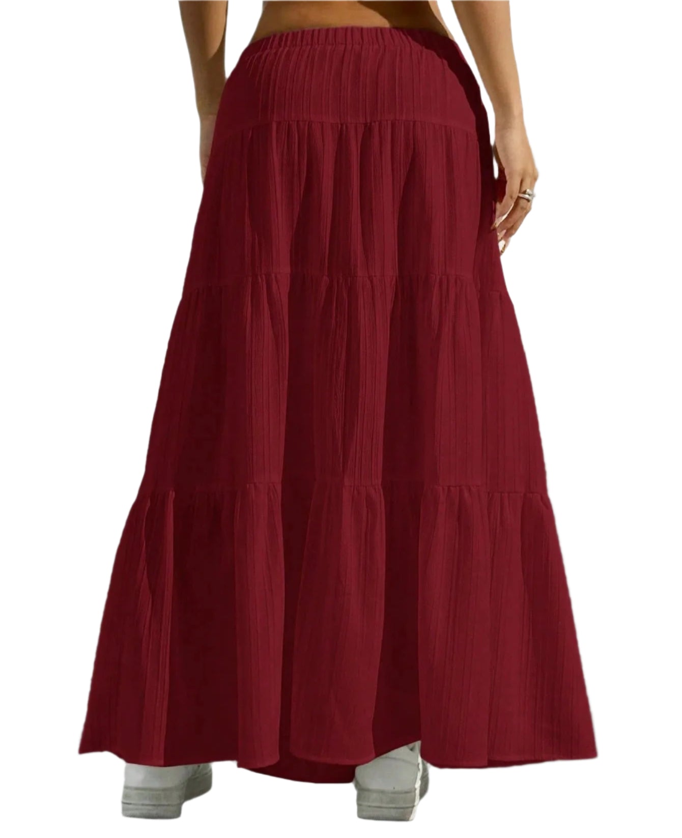 Red tiered skirt worn by a person on a plain background