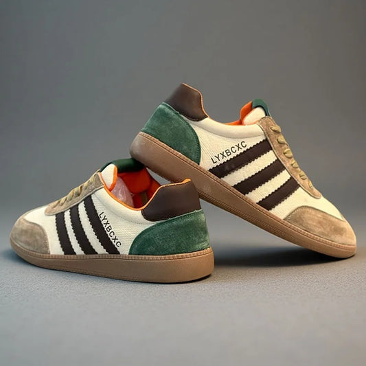 Pair of sneakers with brown, green, and white color scheme on a gray background
