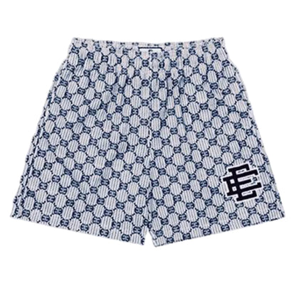 Patterned shorts with a logo on a light gray background