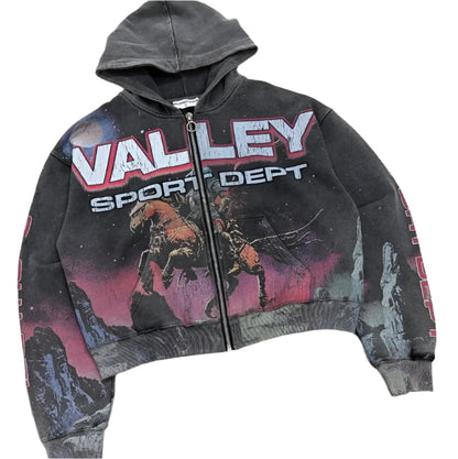 Black hoodie with 'Valley Sport Dept' text and graphic design on a concrete floor.