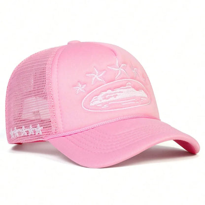 Pink cap with white embroidered design on a white background