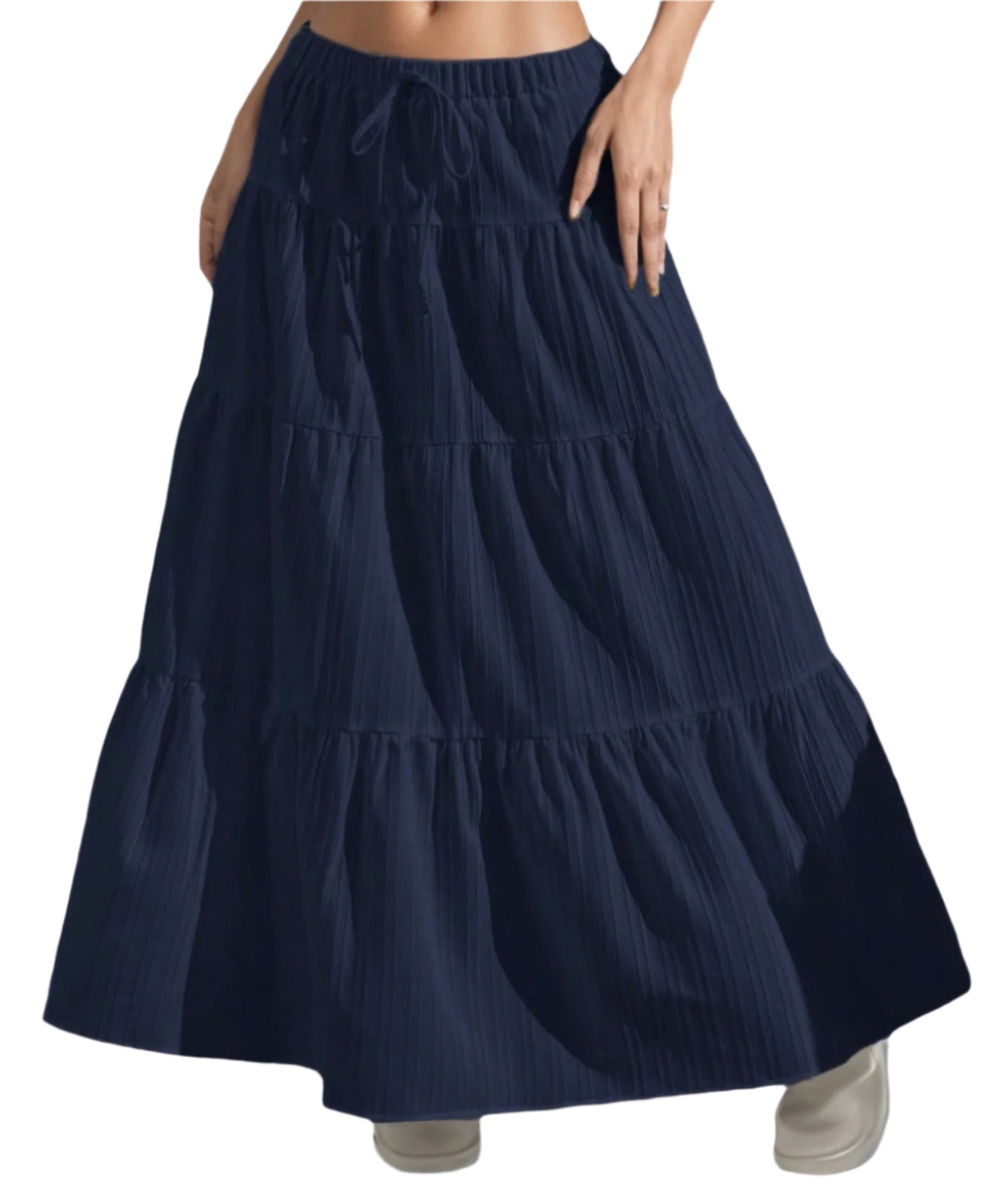 Navy blue tiered skirt worn by a person on a light gray background