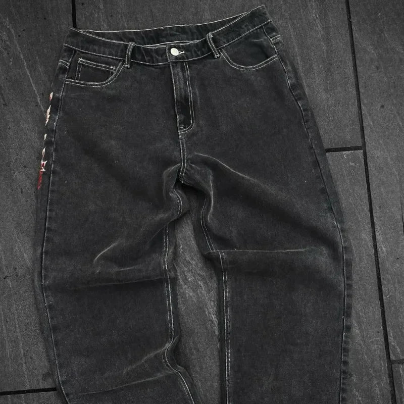 Black jeans on a wooden floor
