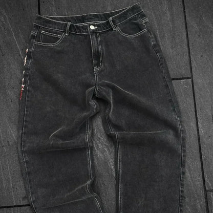 Black jeans on a wooden floor