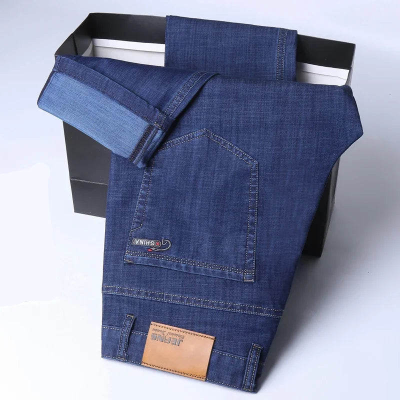 Blue jeans with a brand label on a white background