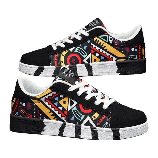 Colorful patterned sneakers with black and white accents on a gray background