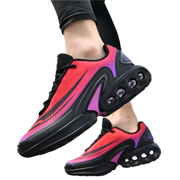 Person wearing pink and black athletic shoes on a road with a blurred background