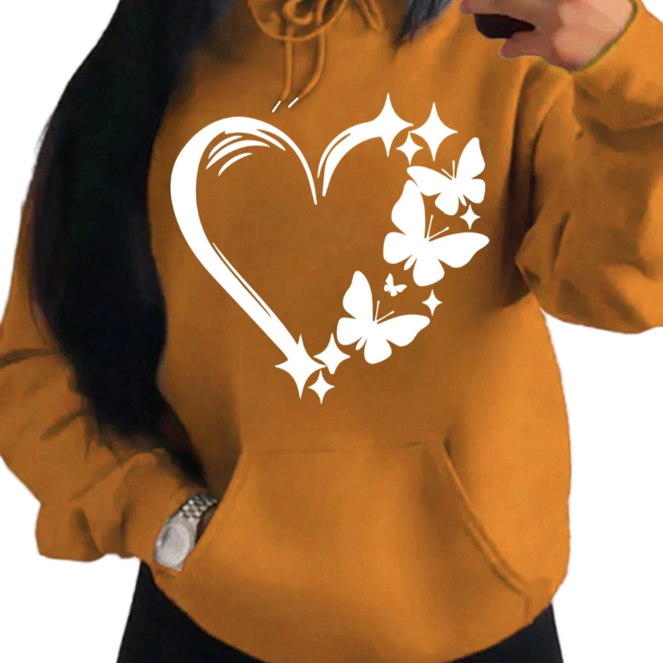 Mustard yellow hoodie with a heart and butterfly design on a plain background