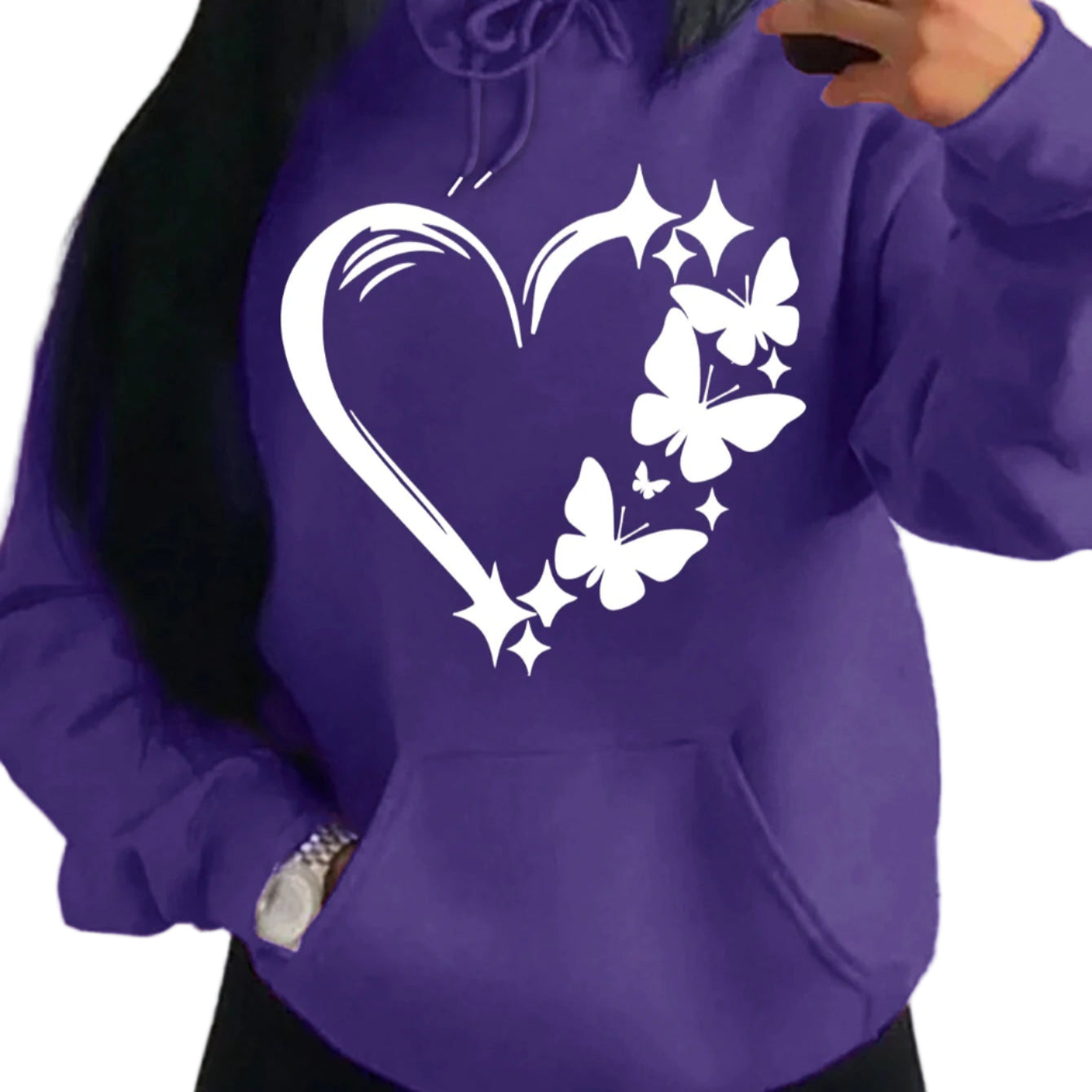 Purple hoodie with a heart and butterfly design worn by a person.