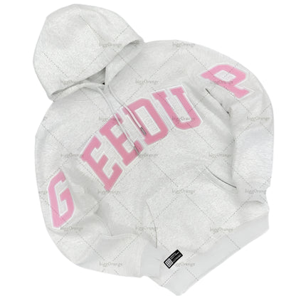 White quilted jacket with pink text on a gray textured background