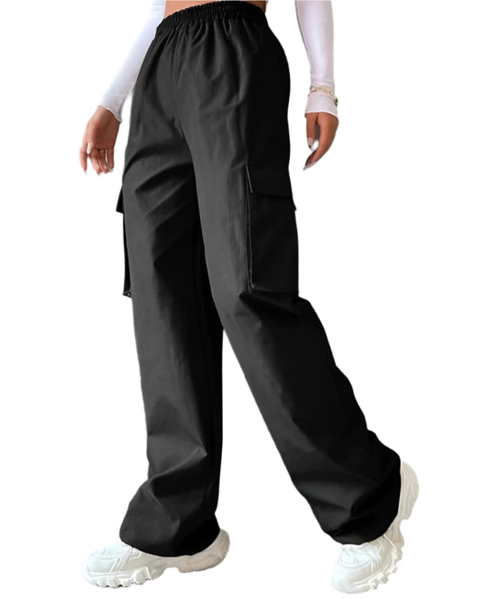 Person wearing black high-waisted pants with a plain background