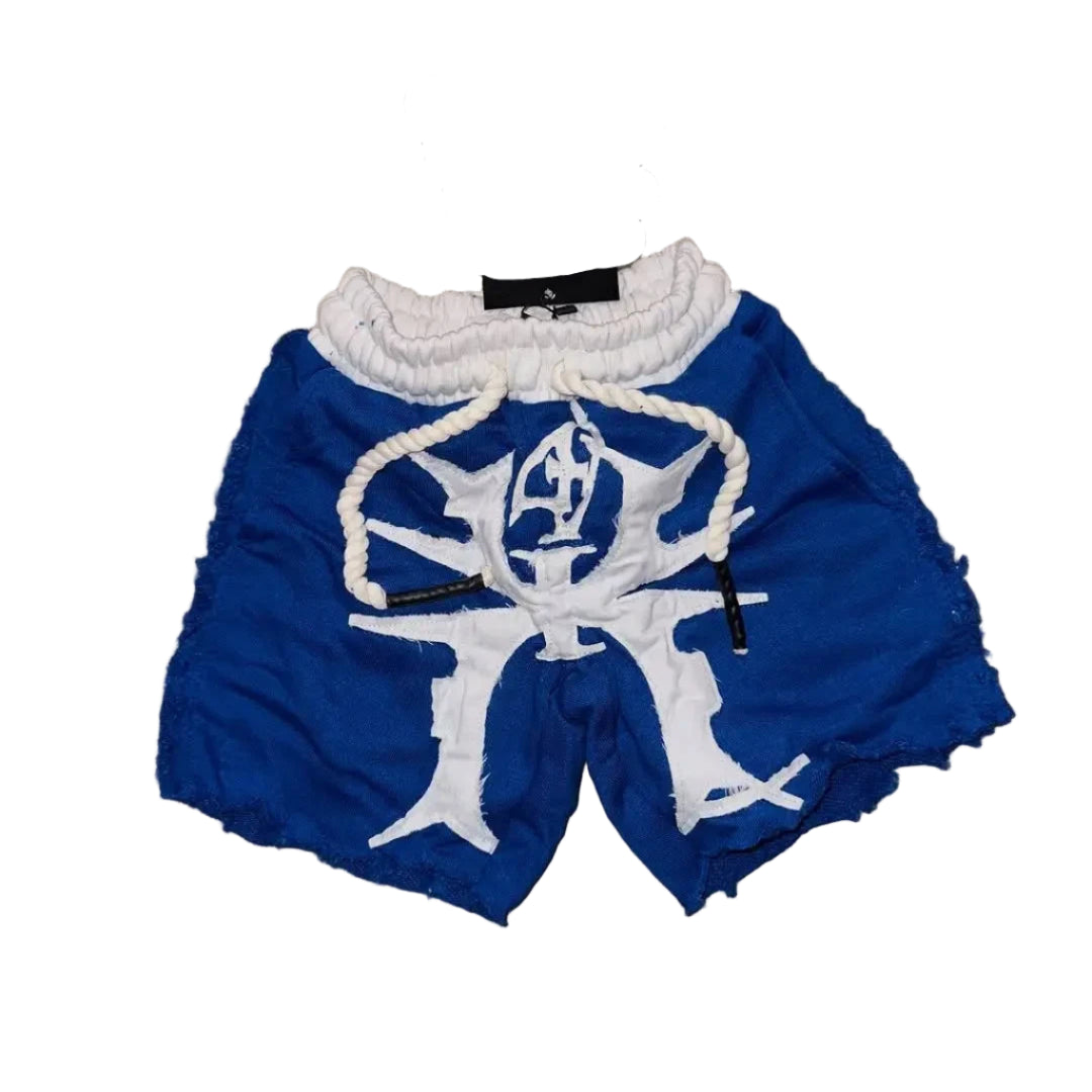 Blue shorts with white designs on a textured surface