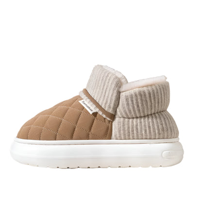 Brown and beige quilted slippers with white sole on a neutral background