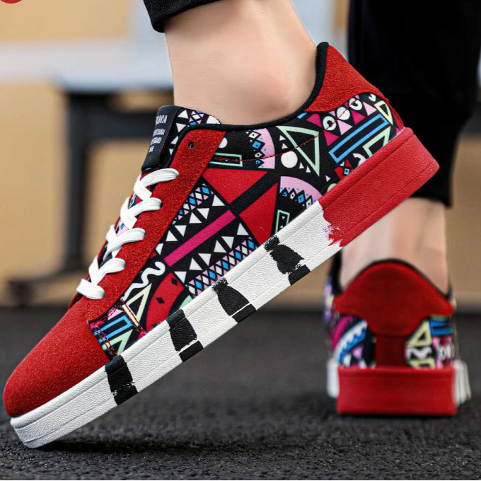 Red sneakers with geometric pattern worn by a person, brand 'RZL' visible.