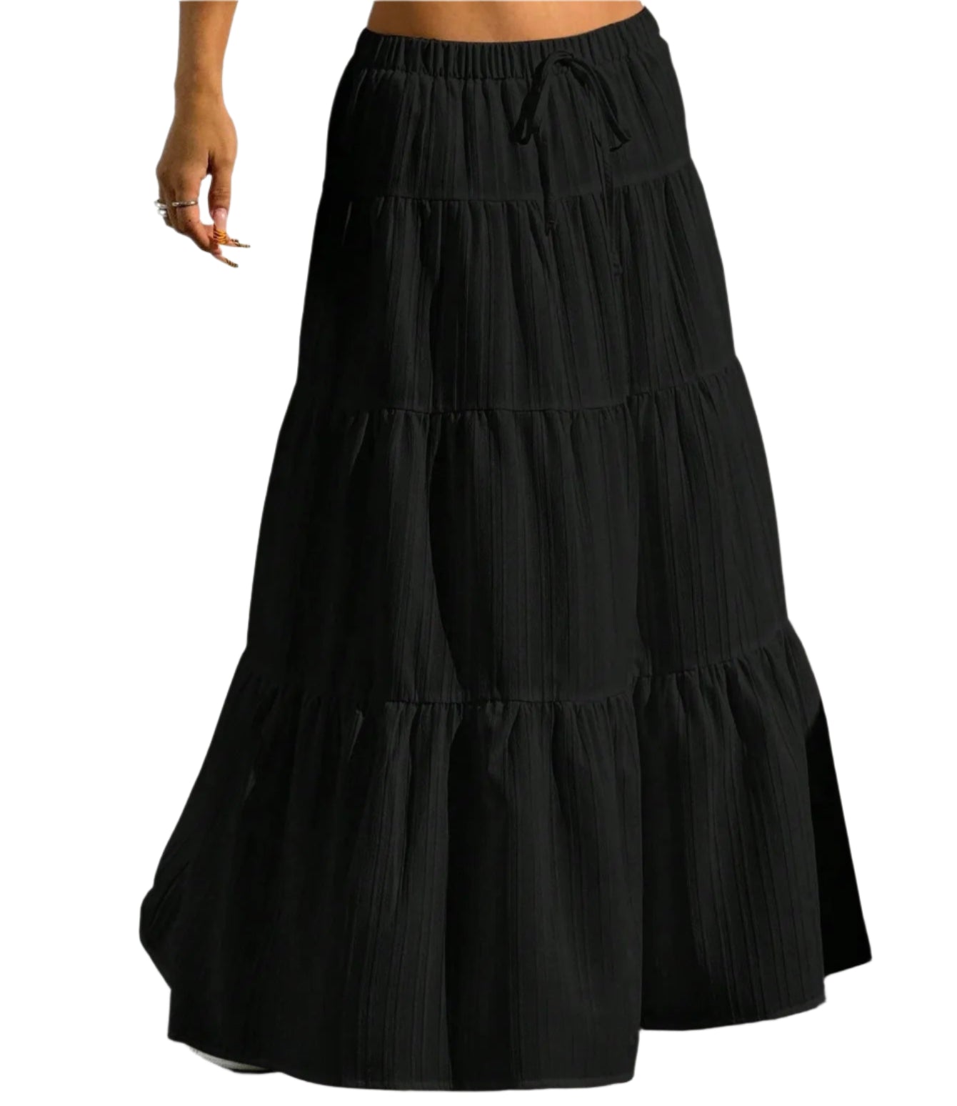 Black tiered skirt worn by a person against a plain background