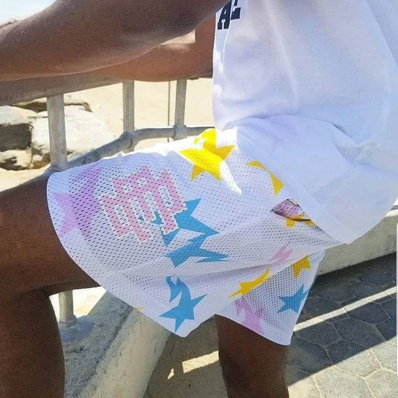 Person wearing a white skirt with colorful star patterns outdoors.