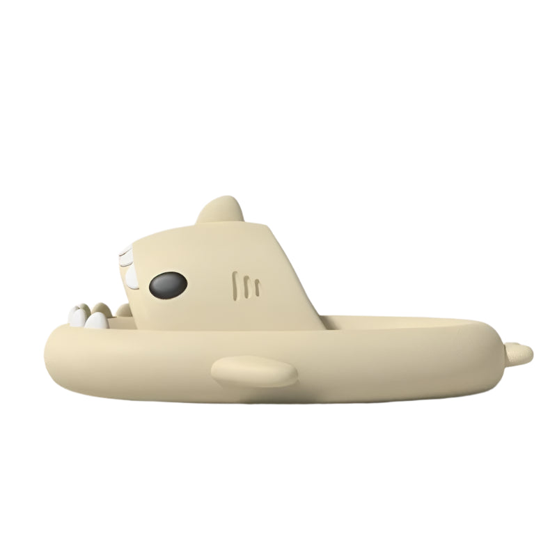 Beige shark-shaped sandal with a black eye on a light gray background