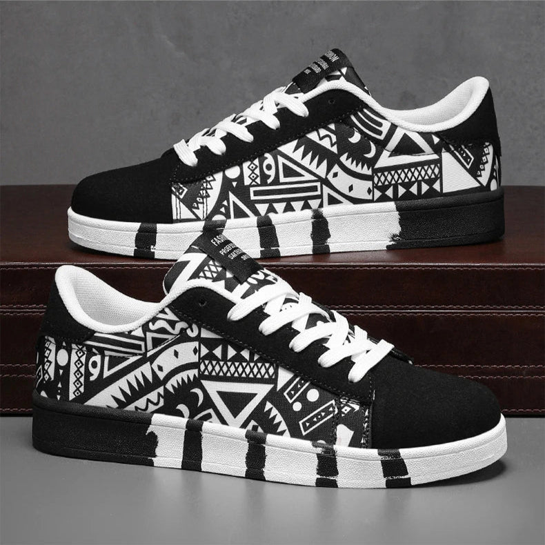 Black and white patterned sneakers on a gray surface with a dark brown wooden shelf in the background.