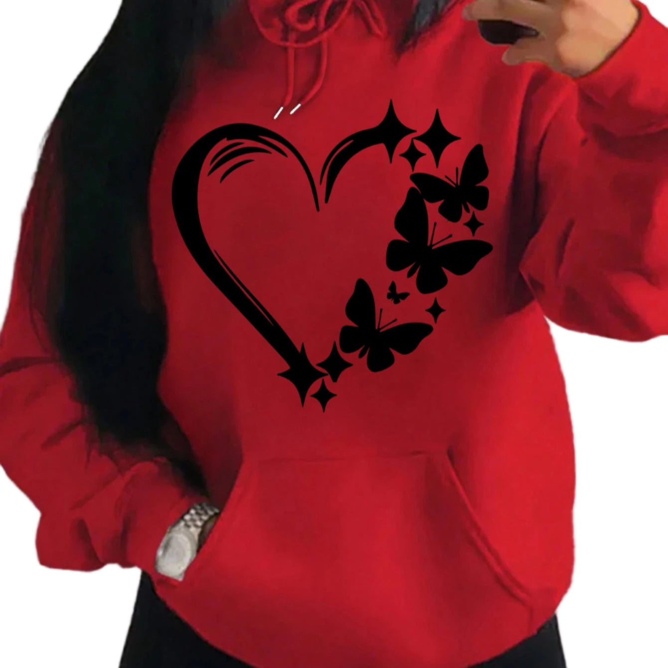 Red hoodie with black heart and butterfly design worn by a person.