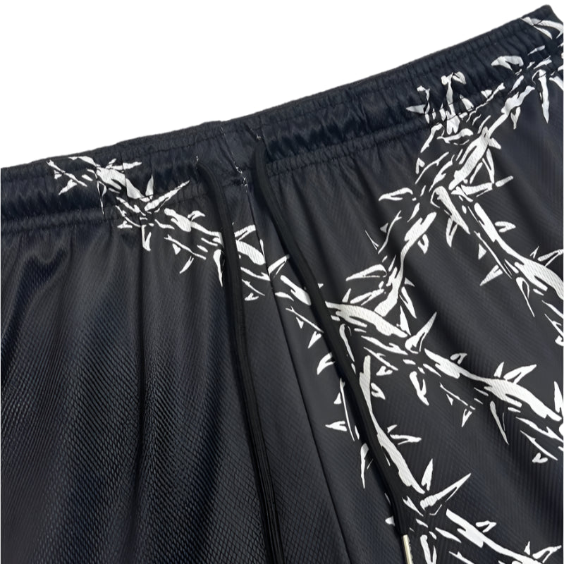 Black shorts with white barbed wire pattern on a white background