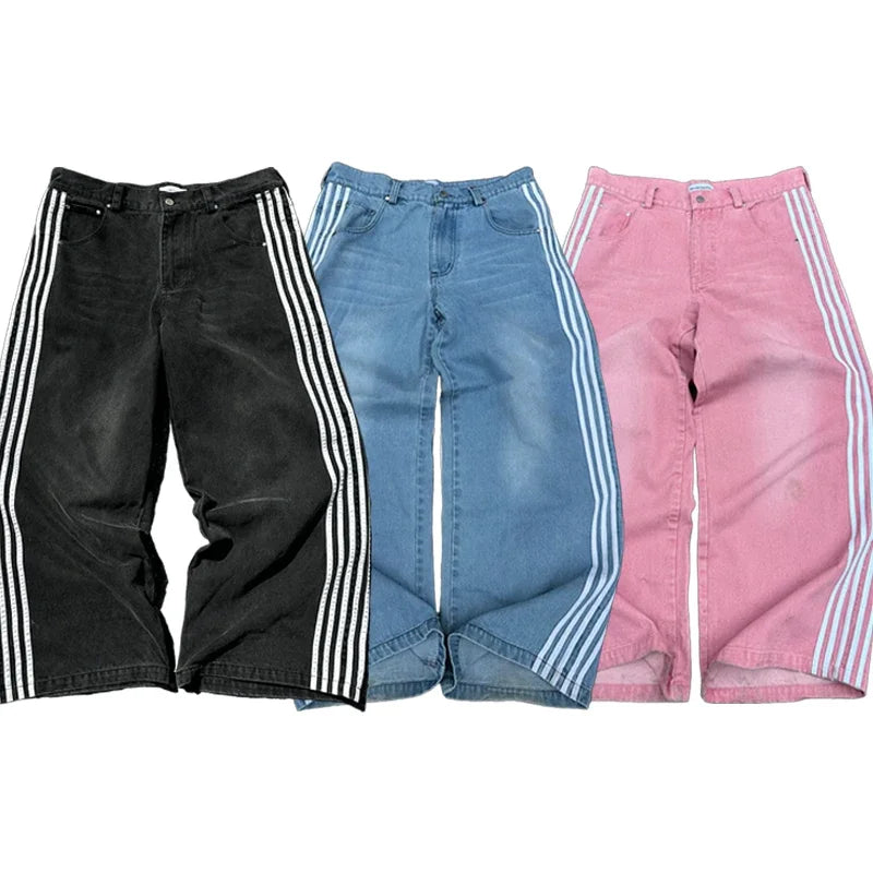 Three pairs of pants in black, blue, and pink with white stripes on a white background