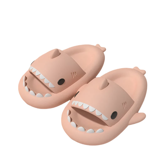 Pink shark-shaped airpods on a pink background