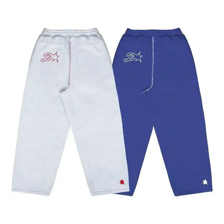 White and blue pants with logos on a white background