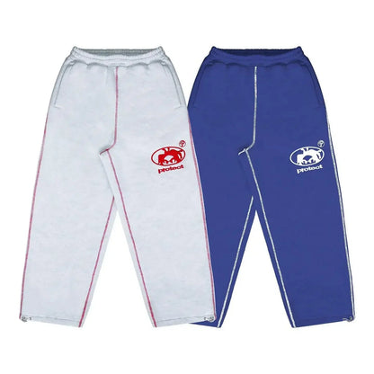White and blue pants with logos on a white background