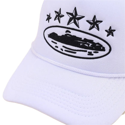 White cap with black star design and logo on a beige background