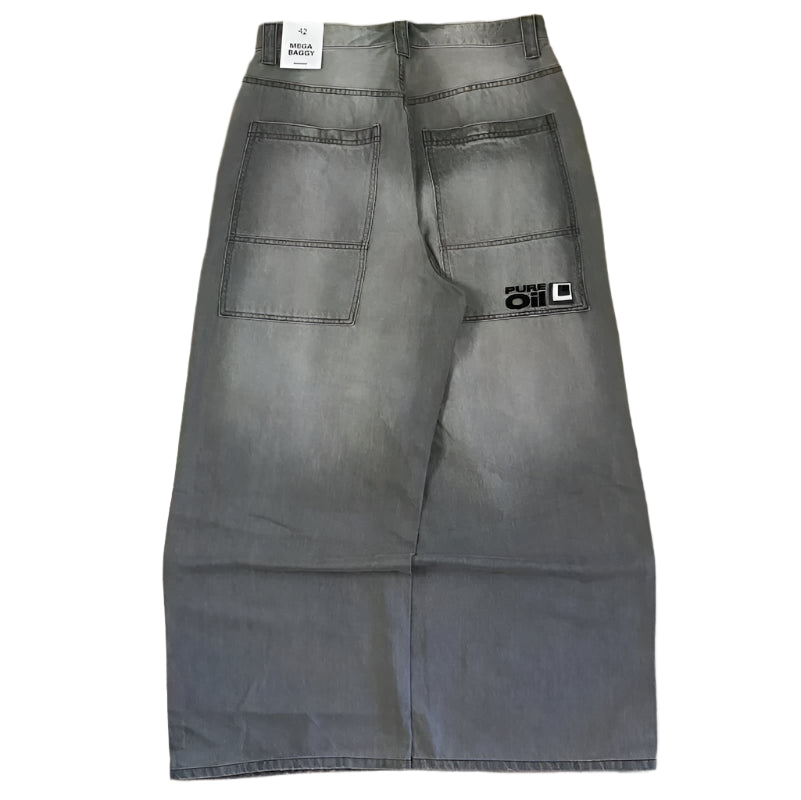 Gray pants with a brand logo on a wooden floor
