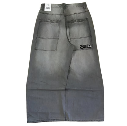 Gray pants with a brand logo on a wooden floor