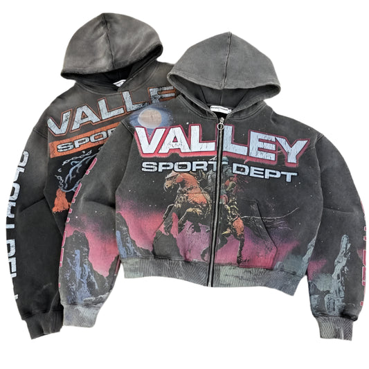 Two hoodies with 'Valley Sport Dept' branding on a textured surface