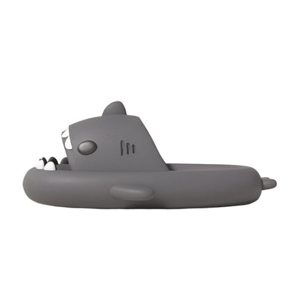 Gray shark-shaped toy on a white background